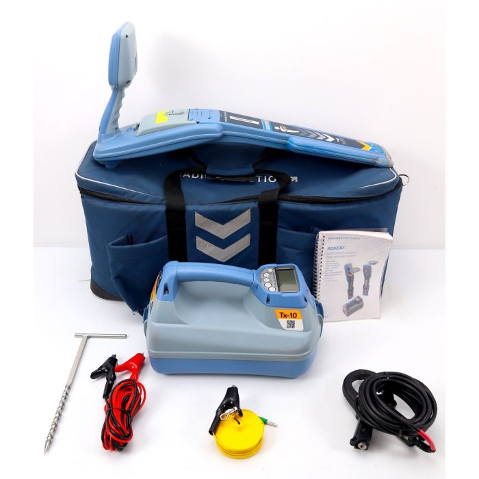 Radiodetection RD8200 precision cable and pipe locator unit with transmitter, signal clamps, and AA batteries. An advanced device designed for locating underground utilities with high-precision technology and multiple active frequencies.
